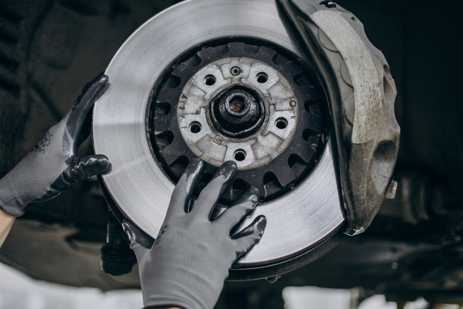 mechanic changing brake discs car service